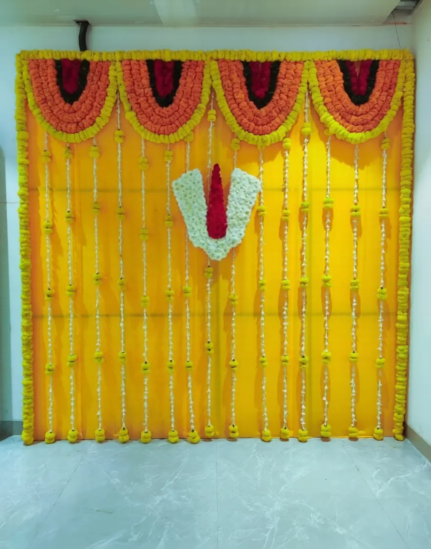 Yellow flower curtain and red-white floral symbol as a ceremony backdrop