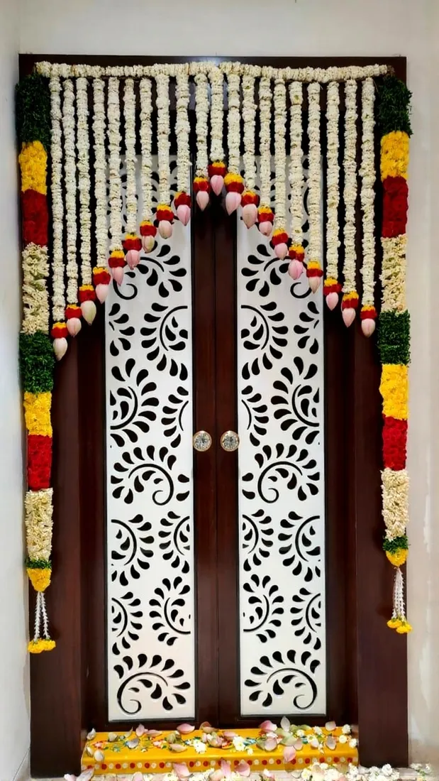 White floral strings framing a decorated home entrance